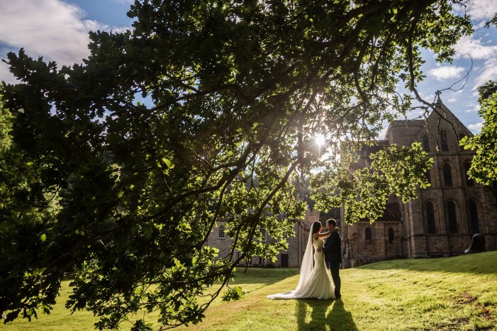 wedding-couple-in-grounds-at-brinkburn-northumberland
